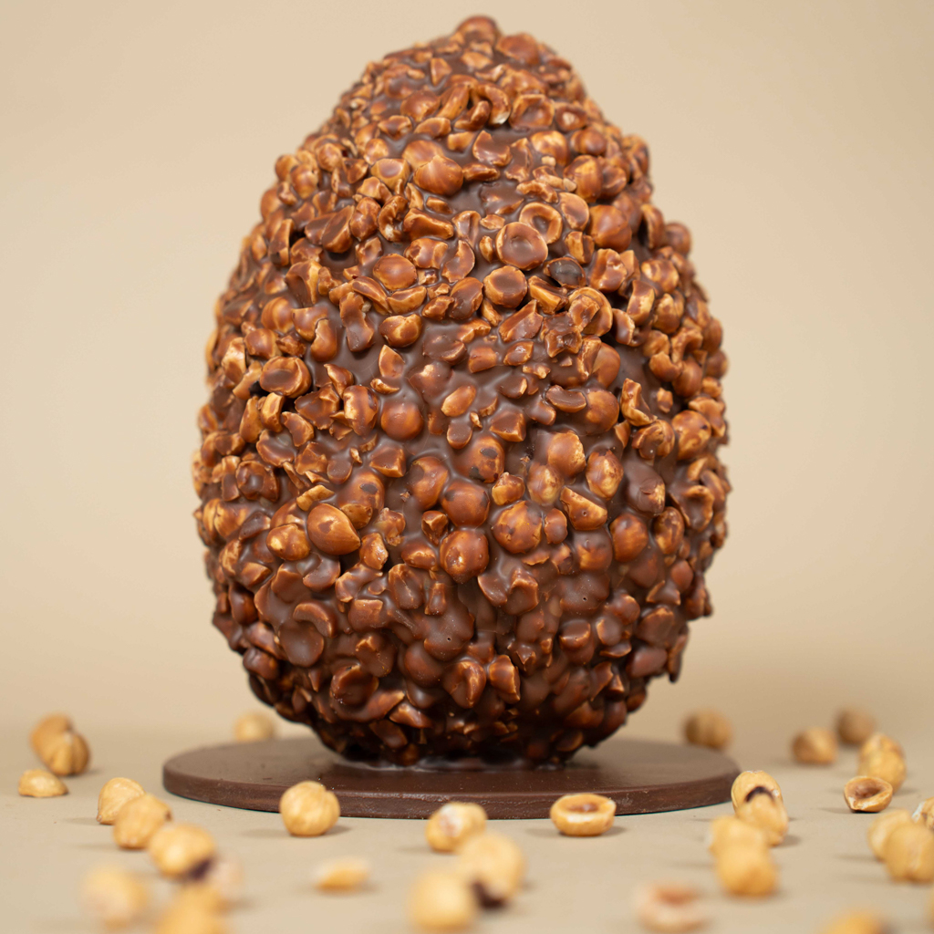 Milk chocolate egg with hazelnuts